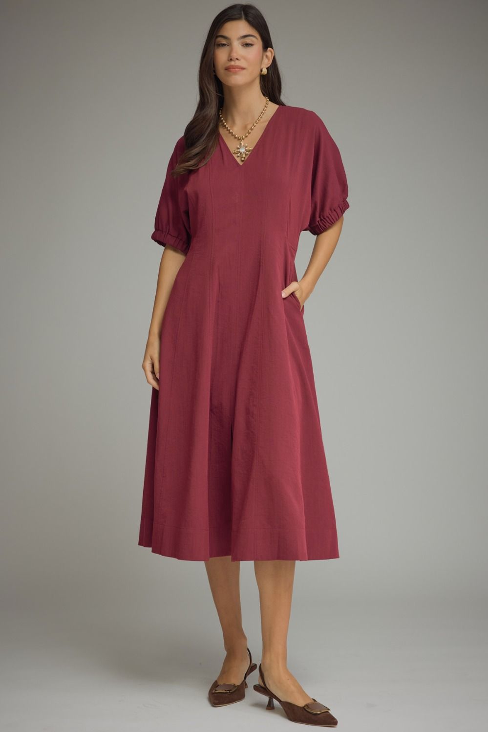 Solid short puff sleeve midi dress featuring a V-neckline
