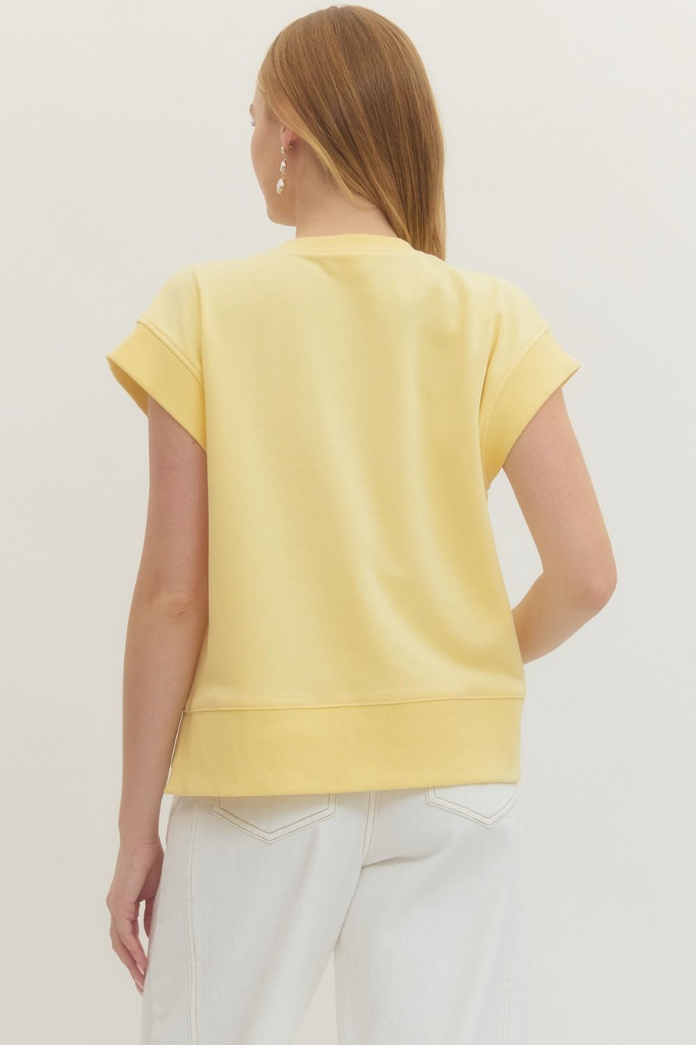 Solid short sleeve top featuring V-neckline