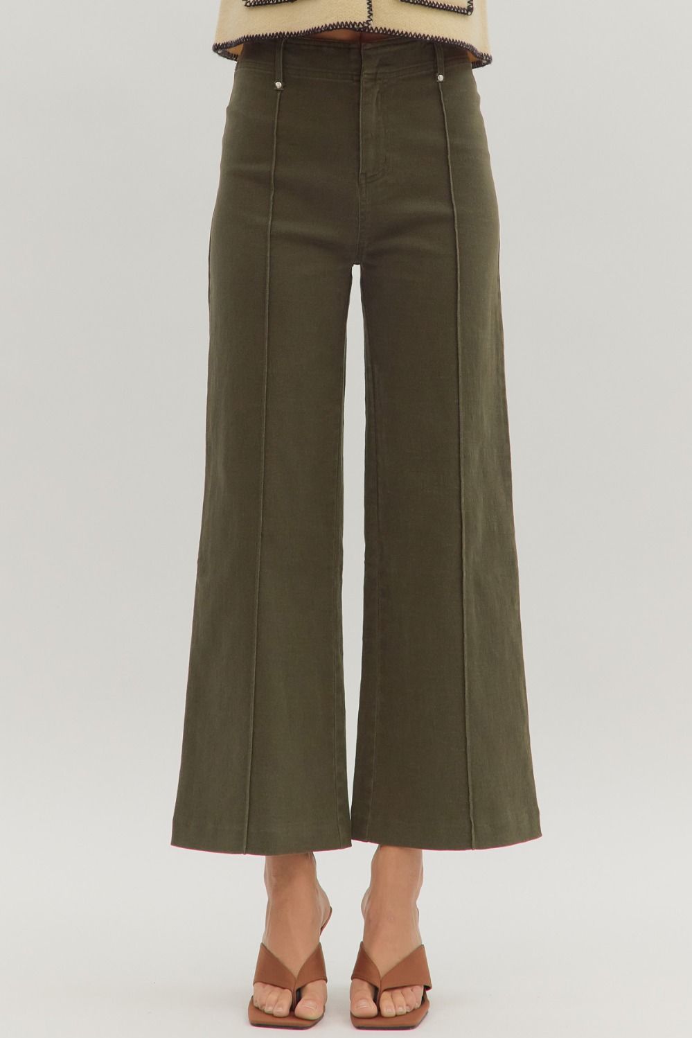 Solid high rise wide leg pants featuring front seam detail