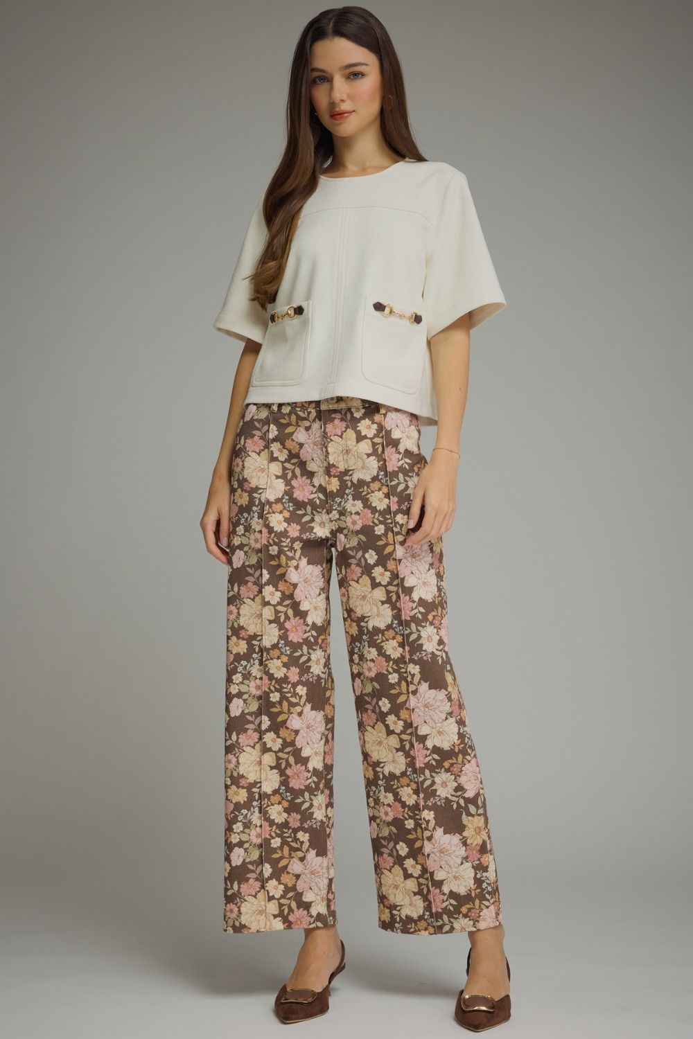 Floral print pants featuring front seam detail