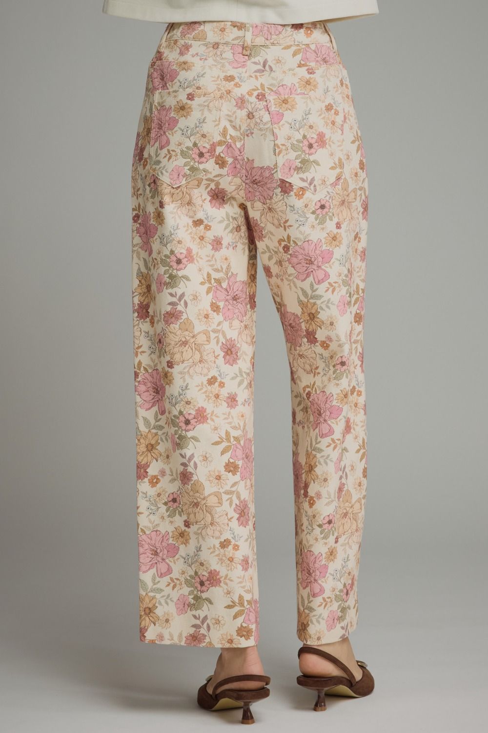 Floral print pants featuring front seam detail