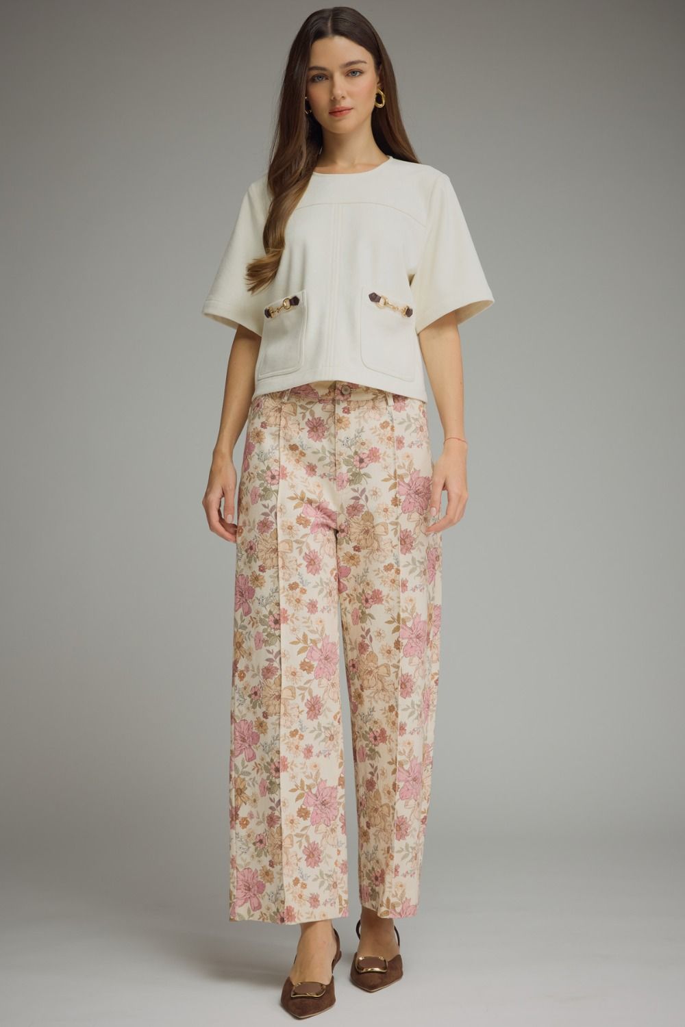 Floral print pants featuring front seam detail