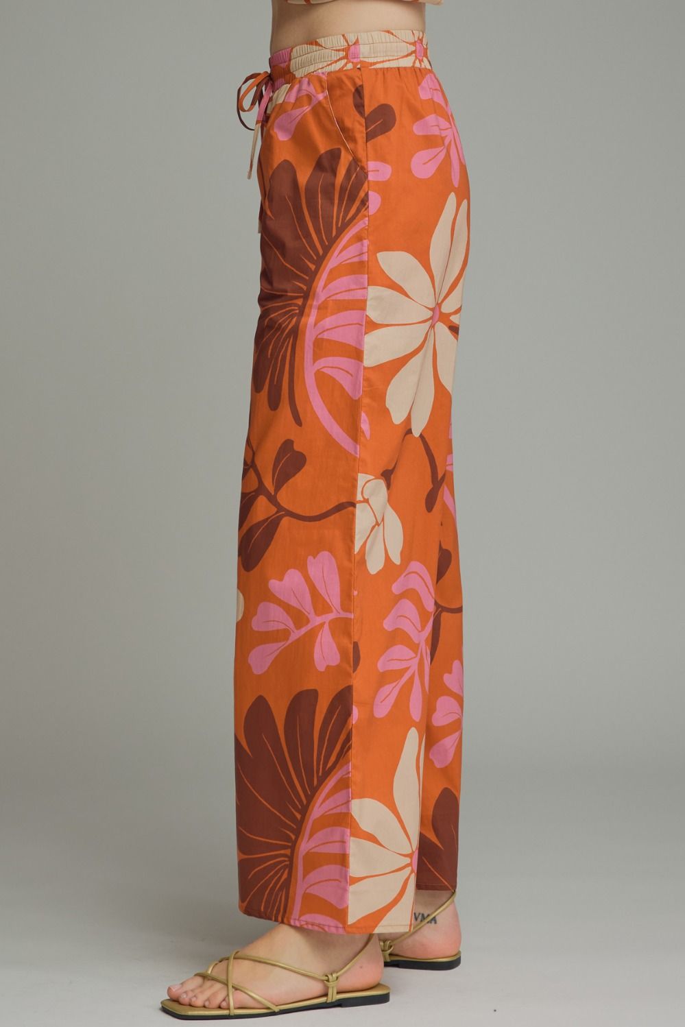 Floral print wide leg pants featuring elasticated waistband with drawstring