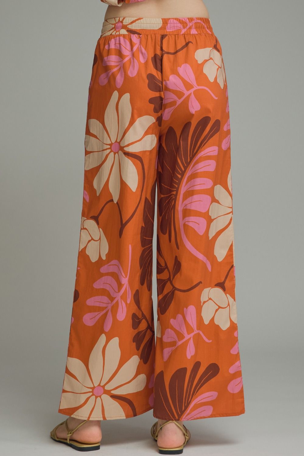 Floral print wide leg pants featuring elasticated waistband with drawstring