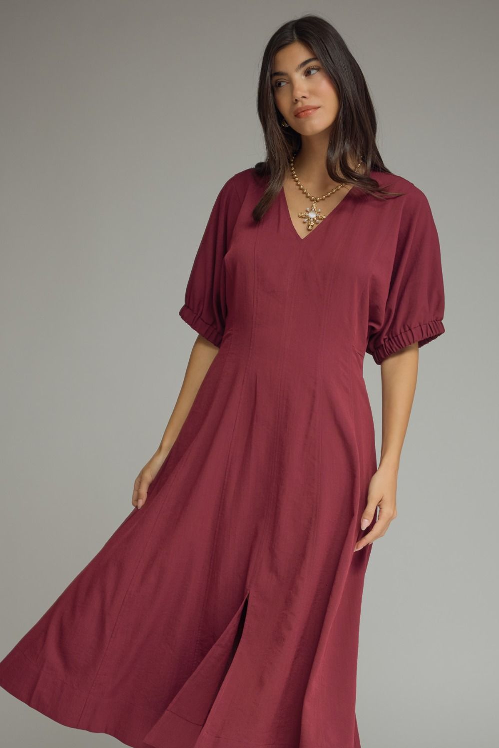 Solid short puff sleeve midi dress featuring a V-neckline