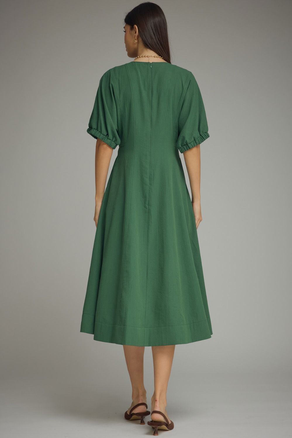 Solid short puff sleeve midi dress featuring a V-neckline