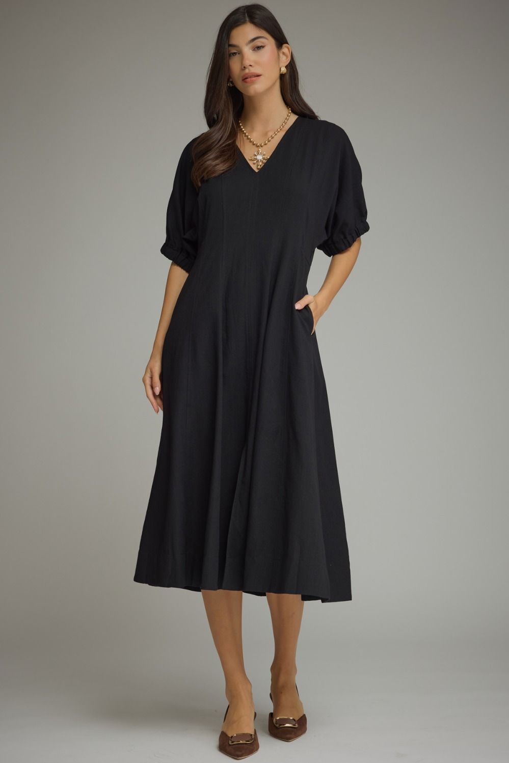 Solid short puff sleeve midi dress featuring a V-neckline