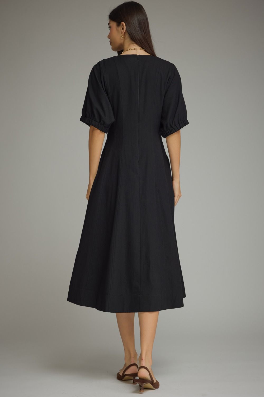 Solid short puff sleeve midi dress featuring a V-neckline