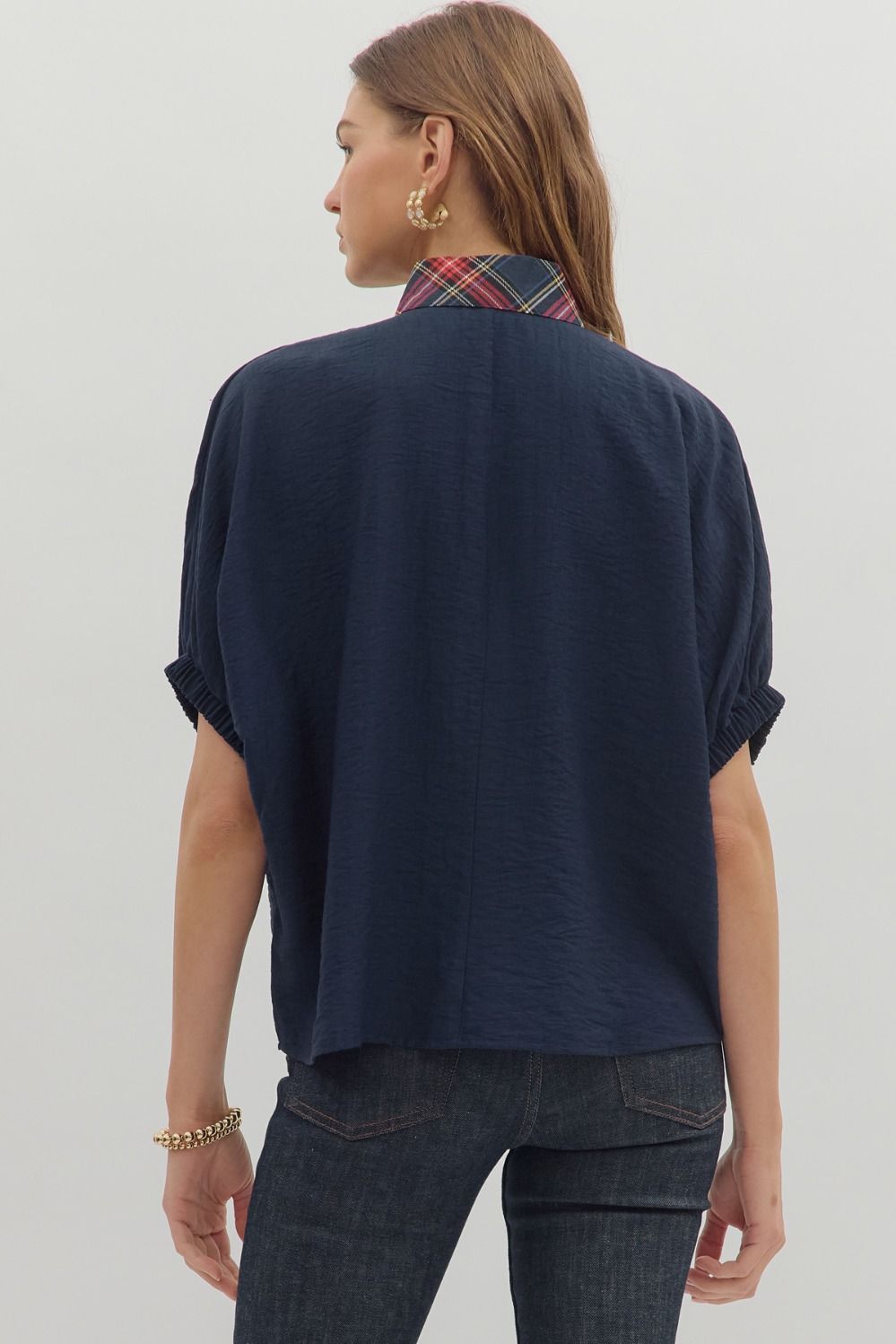 Solid short sleeve dolman top featuring plaid pattern