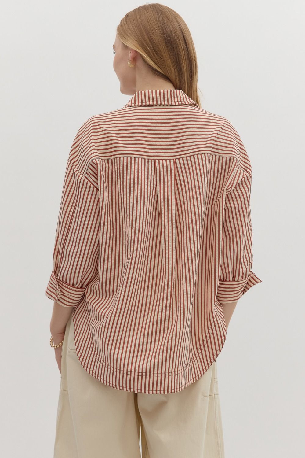 Textured stripe pattern reverse cuff ¾ sleeve shirt. Double shirt pockets at front