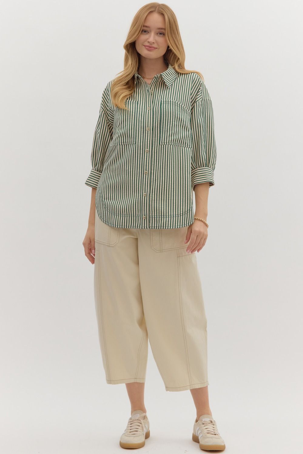 Textured stripe pattern reverse cuff ¾ sleeve shirt. Double shirt pockets at front