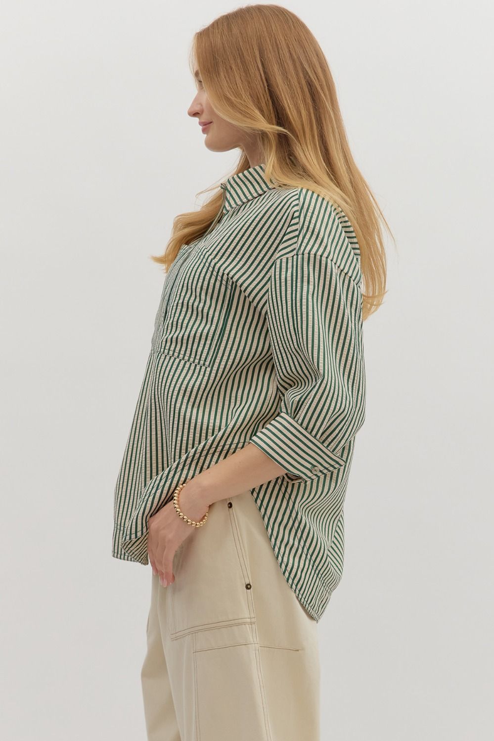 Textured stripe pattern reverse cuff ¾ sleeve shirt. Double shirt pockets at front