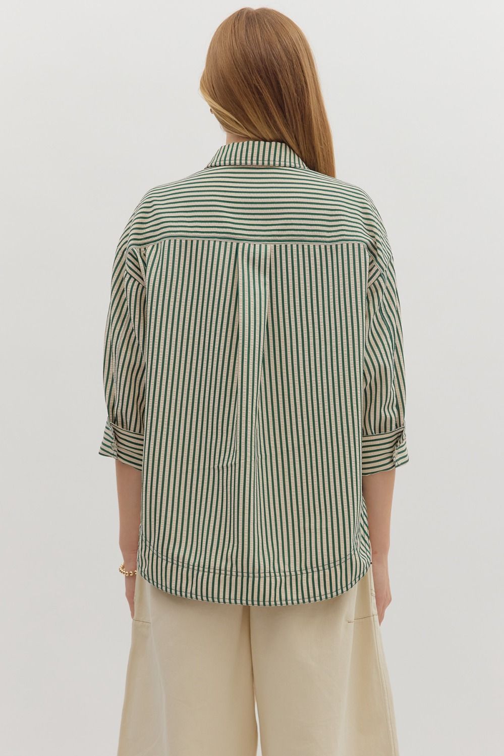 Textured stripe pattern reverse cuff ¾ sleeve shirt. Double shirt pockets at front