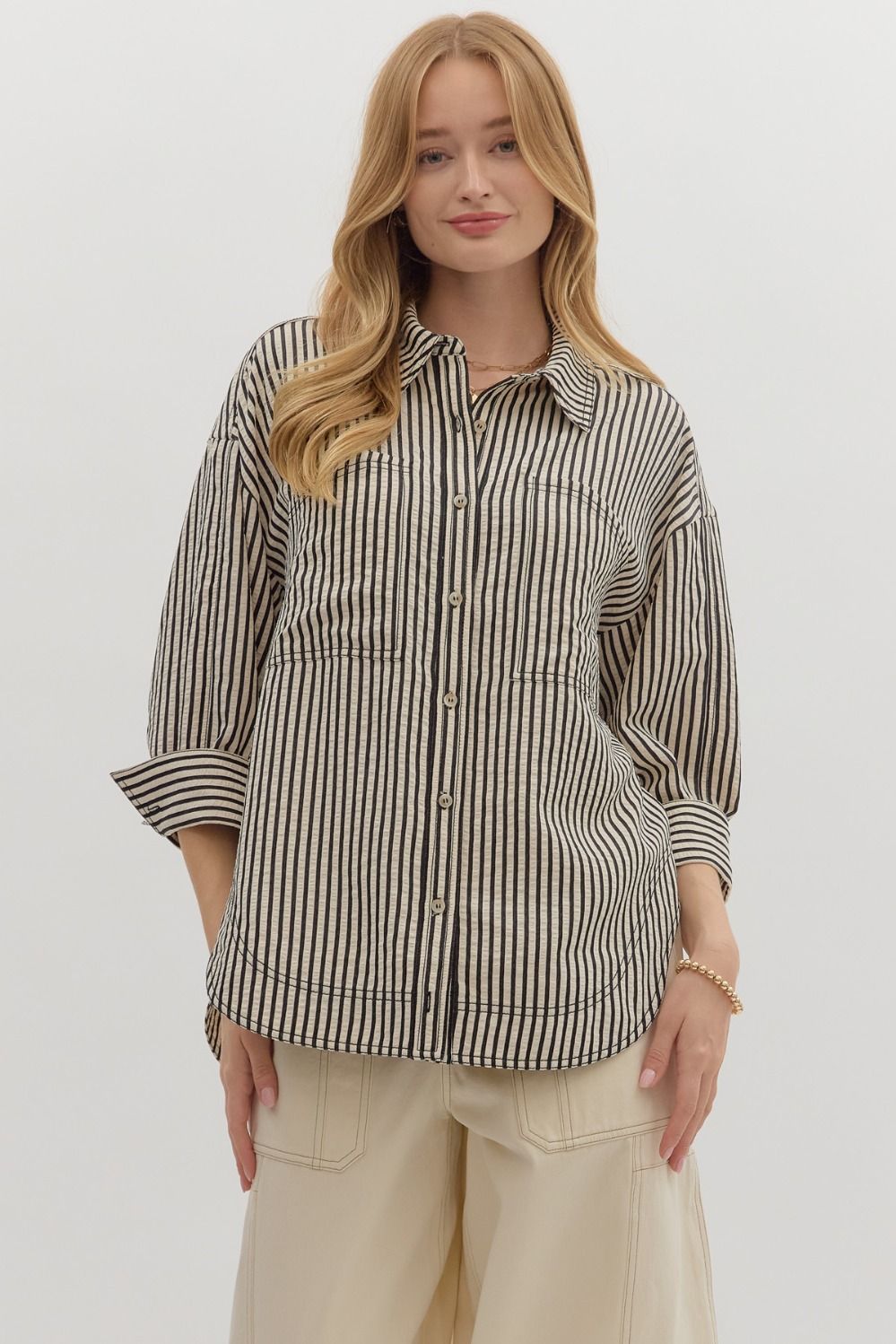Textured stripe pattern reverse cuff ¾ sleeve shirt. Double shirt pockets at front
