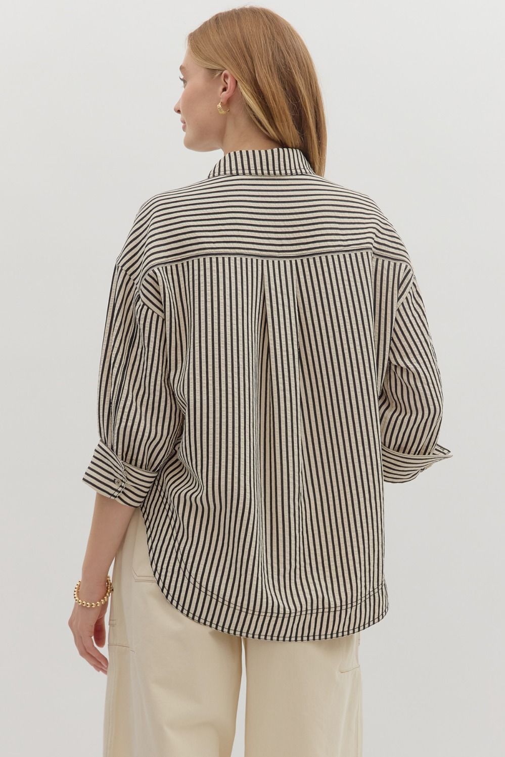 Textured stripe pattern reverse cuff ¾ sleeve shirt. Double shirt pockets at front