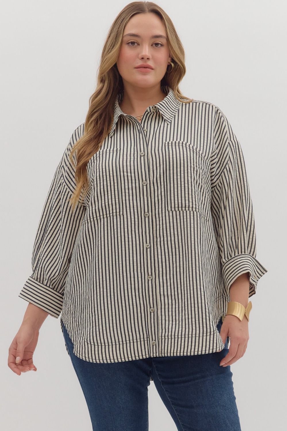 Textured stripe pattern reverse cuff ¾ sleeve shirt. Double shirt pockets at front