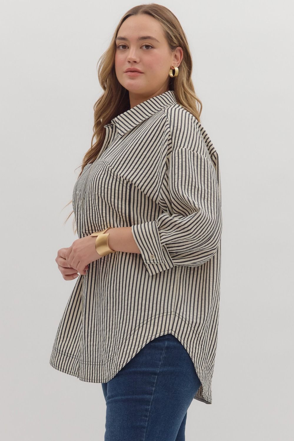 Textured stripe pattern reverse cuff ¾ sleeve shirt. Double shirt pockets at front