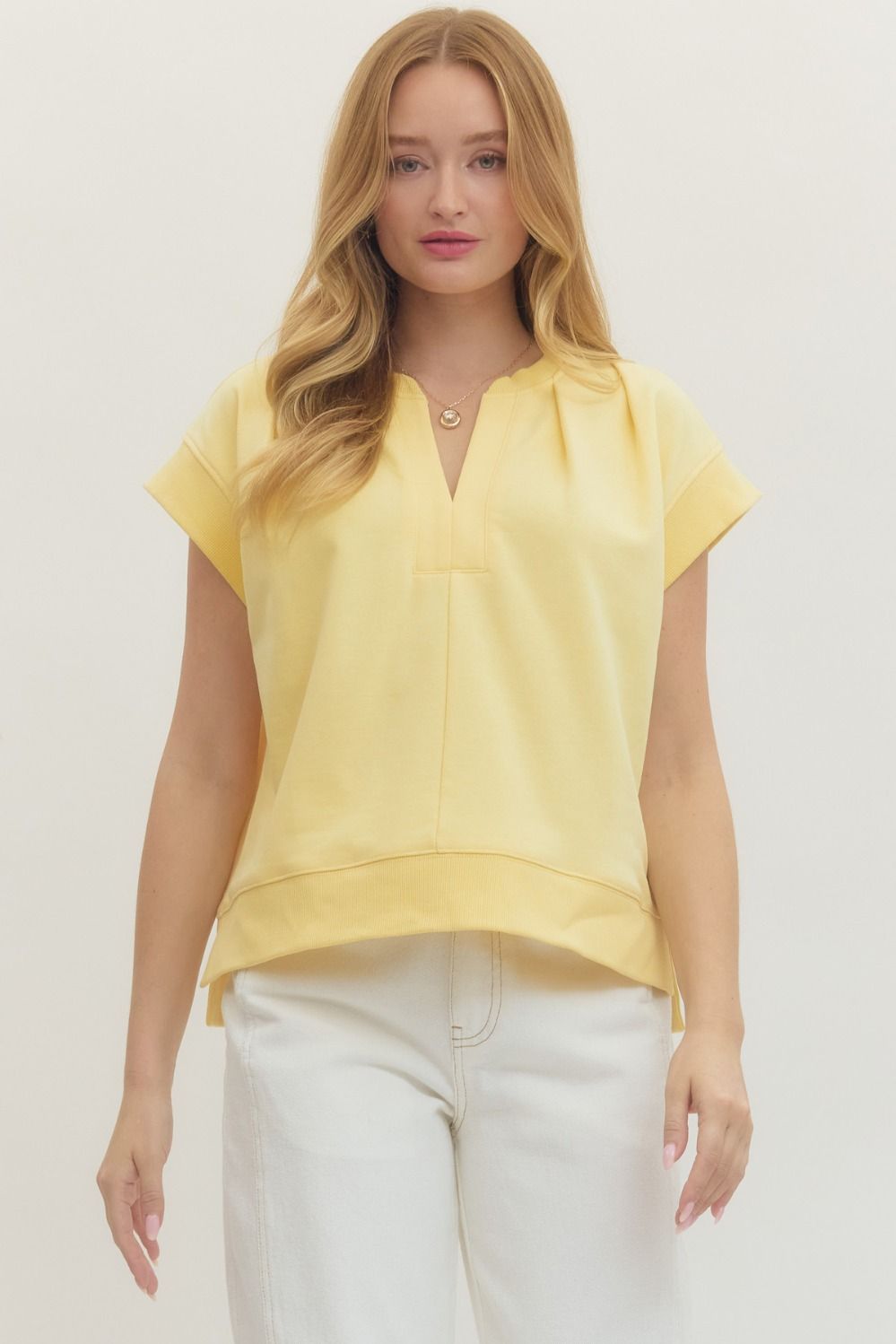 Solid short sleeve top featuring V-neckline