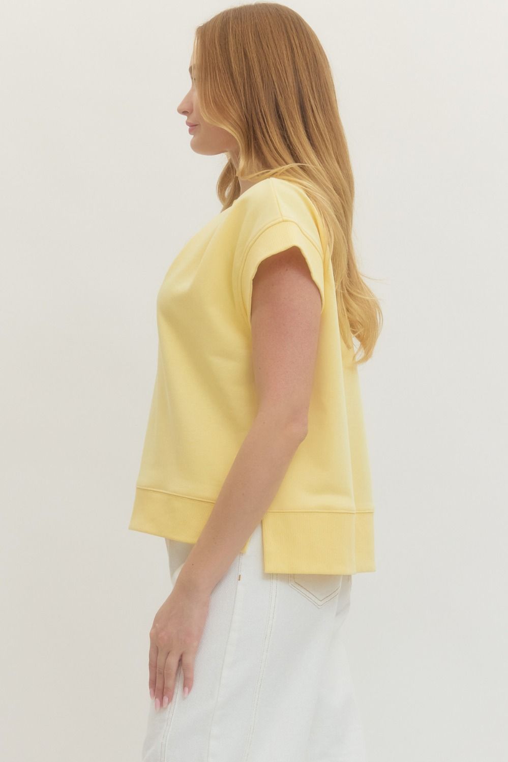 Solid short sleeve top featuring V-neckline
