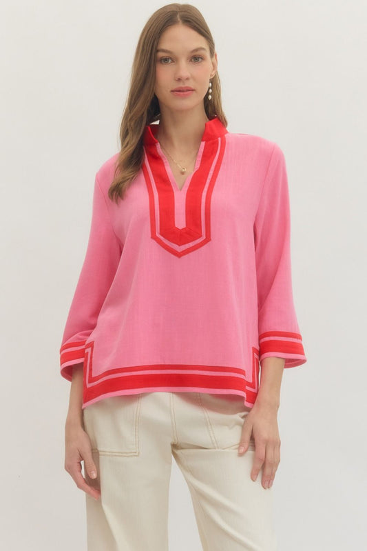 Solid 3/4 sleeve top featuring contrast trim V-neck collar