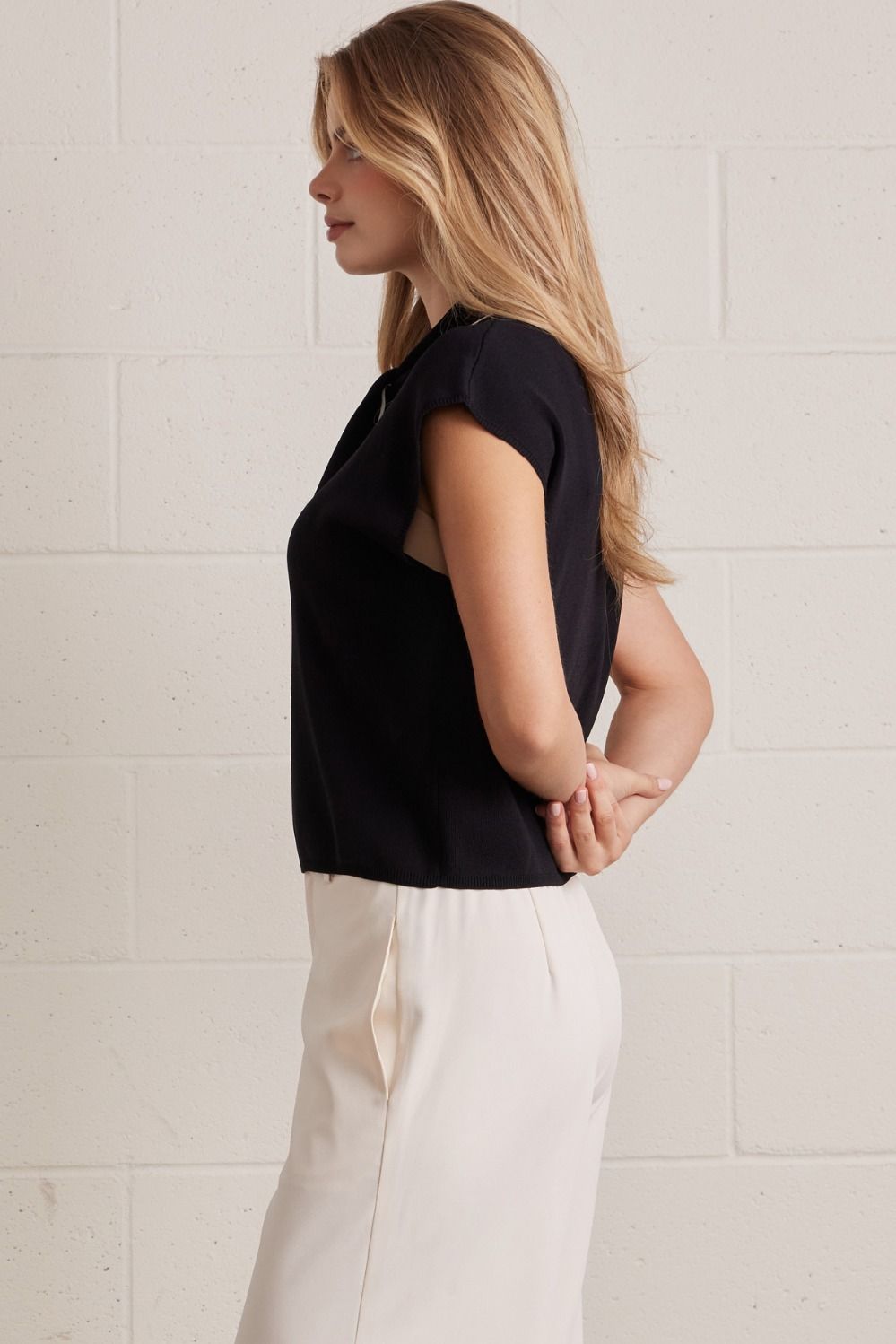 Solid sleeveless sweater top featuring self-tie scarf