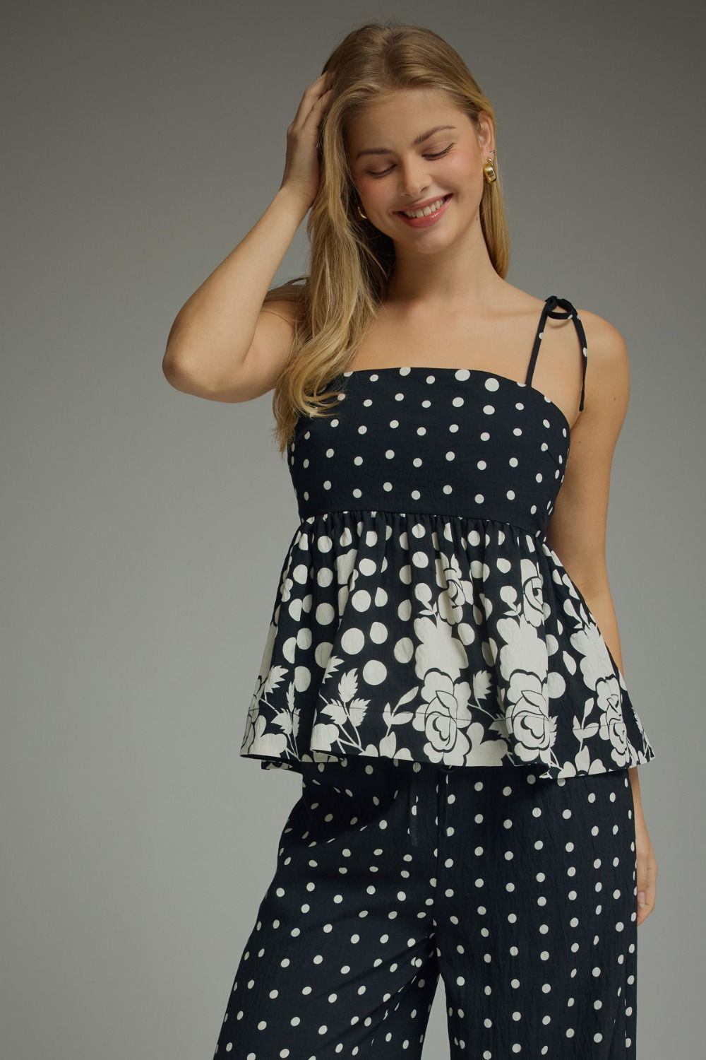 Polka dot self-tie sleeveless top